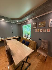 a dining room with a table and chairs and a window at Opushka in Vorobʼyëvka +124 photos