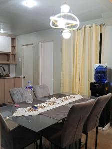 a dining room table with chairs at Welcome to Hambella home in Mactan +2 photos