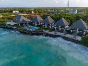 an aerial view of a resort on the water at Mahi Mahi Beach Hotel in Jambiani