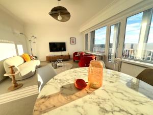 a living room with a table and a living room with a view at Casa Cielo-Spectacular View-Center-Chic-Spacious in Liège
