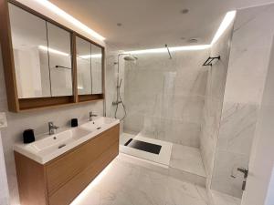 a white bathroom with a sink and a shower at Casa Cielo-Spectacular View-Center-Chic-Spacious in Liège +45 photos