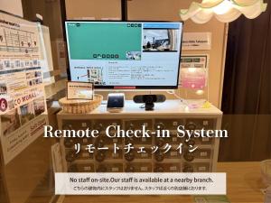 a display of a computer screen in a store window at Backpackers Hida Takayama in Takayama