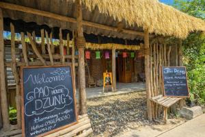 a restaurant with a sign in front of a building at PaoDzung Homestay Sapa in Sapa +47 photos