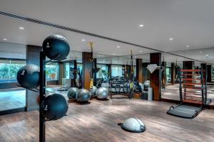 a gym with a lot of exercise balls and mirrors at Islamabad Marriott Hotel in Islamabad