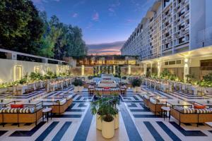 a rendering of a hotel patio with tables and chairs at Islamabad Marriott Hotel in Islamabad