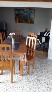 a living room with a dining room table and chairs at Gite Du Grand Morin in Villeneuve-la-Lionne
