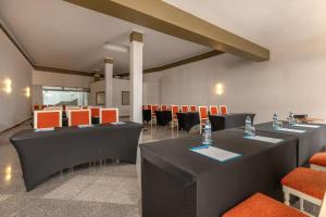 a large room with tables and chairs in it at Alua Atlantico Golf - All Inclusive in San Miguel de Abona +77 photos