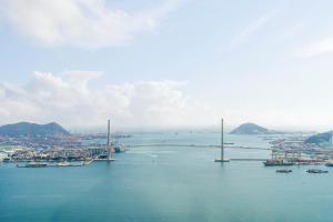 an aerial view of a bridge over a body of water at Brown Suites Busan Station in Busan