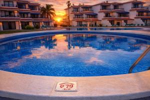 a large swimming pool in front of a building at Lago Azul 59 SEA VIEW LOS CANCAJOS in Los Cancajos