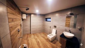 a bathroom with a toilet and a sink at 1 Forest Soul - Forest Side Retreat with Pool in Batheri +41 photos