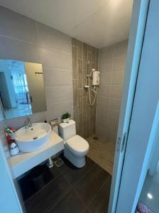 a bathroom with a toilet and a sink at Arte Plus Homestay Condo in Kuala Lumpur