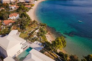 an aerial view of a beach and a house at Luxury Villas Skiathos in Skiathos