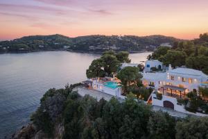 an aerial view of a house on a island in the water at Luxury Villas Skiathos in Skiathos