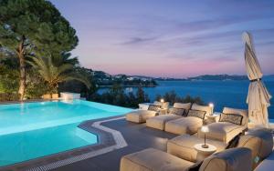 a villa with a swimming pool and a villa at Luxury Villas Skiathos in Skiathos +42 photos