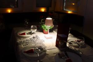 a table with glasses of wine on top of it at Vila Hristov in Delčevo