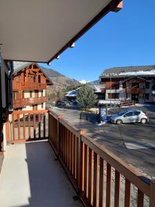a balcony with a view of a parking lot at Chalet des Evettes in Flumet