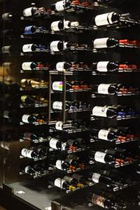 a wine rack filled with lots of wine bottles at The Christiania Mountain Spa Resort in Zermatt
