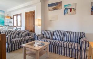 a living room with two couches and a coffee table at Marina D'or Lv Casa 5 in Cala d´Or +18 photos