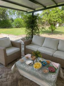a table with bowls of food on a patio at Hacienda Don Rodrigo in Alcalá de Guadaira