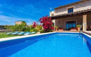 a large swimming pool in front of a house at Etv4268, Casa Tolo in Son Servera +40 photos