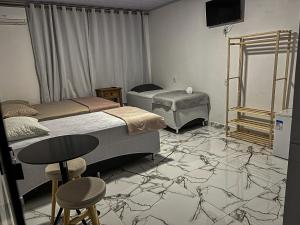 เตียงในห้องที่ Hotel WM