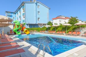 a swimming pool with a slide in a hotel at Hotel Atlantic in Gatteo a Mare