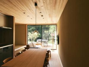 a dining room with a table and a large window at GEOSPOT Motohakone C 2026年1月 New Open in Hakone