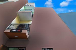 a building with an oops sign on the side of it at Hotel O Green Park Residency 2 in New Delhi +21 photos