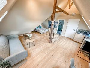 a living room with a couch and a table at Pension Elisa in Bad Friedrichshall