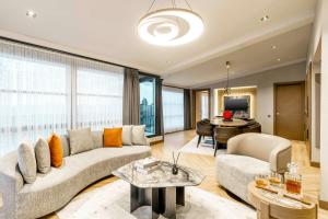 a living room with a couch and a table at AHC Taksim Hotel-Special Class in Istanbul