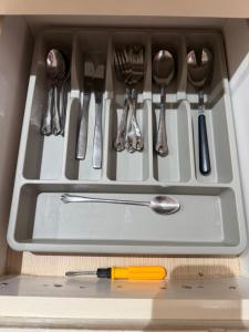 a drawer filled with utensils in a kitchen at honey moon zeinbe 3 in Hammamet