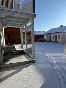 a sliding glass door on the side of a house at Ferienwohnung Mußner im Chiemgau in Tacherting