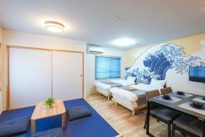 a room with two beds and a table in it at Seed INN Haneda Terrace 201 in Tokyo +84 photos