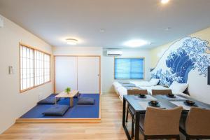 a living room with a couch and a table at Seed INN Haneda Terrace 201 in Tokyo