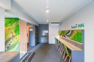 a hallway with a mural on the wall at Seed INN Haneda Terrace 201 in Tokyo
