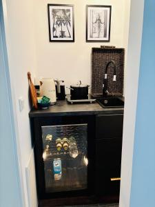 a kitchen counter with a sink and a stove at Guesthouse in Neuhäusel