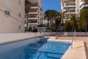 a swimming pool in the middle of a building at Casa LoIa Altea By DelucaCo in Altea