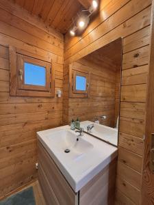 a bathroom with a white sink and a mirror at Casa na Colina in Almancil +11 photos