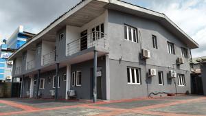 a gray building with a lot of windows at GTKATE Paradise Hotel in Ikeja
