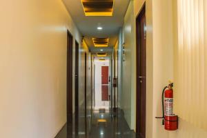a long hallway with a fire hydrant in a building at Alchan Suites in General Santos