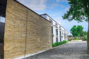 a wooden privacy fence on the side of a building at Alchan Suites in General Santos