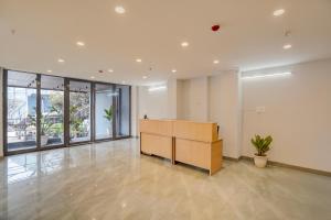 an office with a desk in the middle of a room at Banquesta Suites in Noida