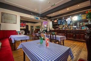 a restaurant with two tables and a bar at The Stag and Hen Pub in Coventry +2 photos