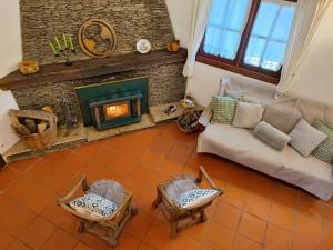 an overhead view of a living room with a fireplace at Casa do Rio, Natureza - Nova Gestão in Melgaço