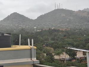 a view of a mountain from a building at Shalom - Stays in Voi