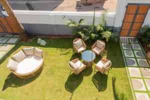 an aerial view of a patio with chairs and a table at Casa Mandala by ELIVAAS in Candolim +66 photos