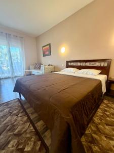 a bedroom with a large bed in a room at Kornilios Istron Hotel in Giannitsa +35 photos