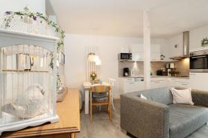 a living room with a couch and a table at Instenweg 14 Sternhus in Rettin