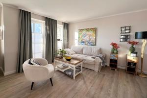 a living room with a couch and a table at Wohnung 9 in Westerland