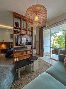 a living room with a couch and a table at YATS Colony in Yogyakarta